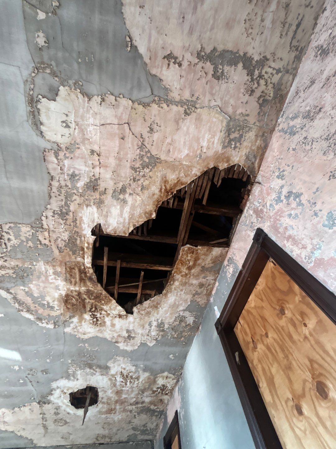 Severe interior ceiling damage and exposed roof framing from a leak in Pottstown, PA