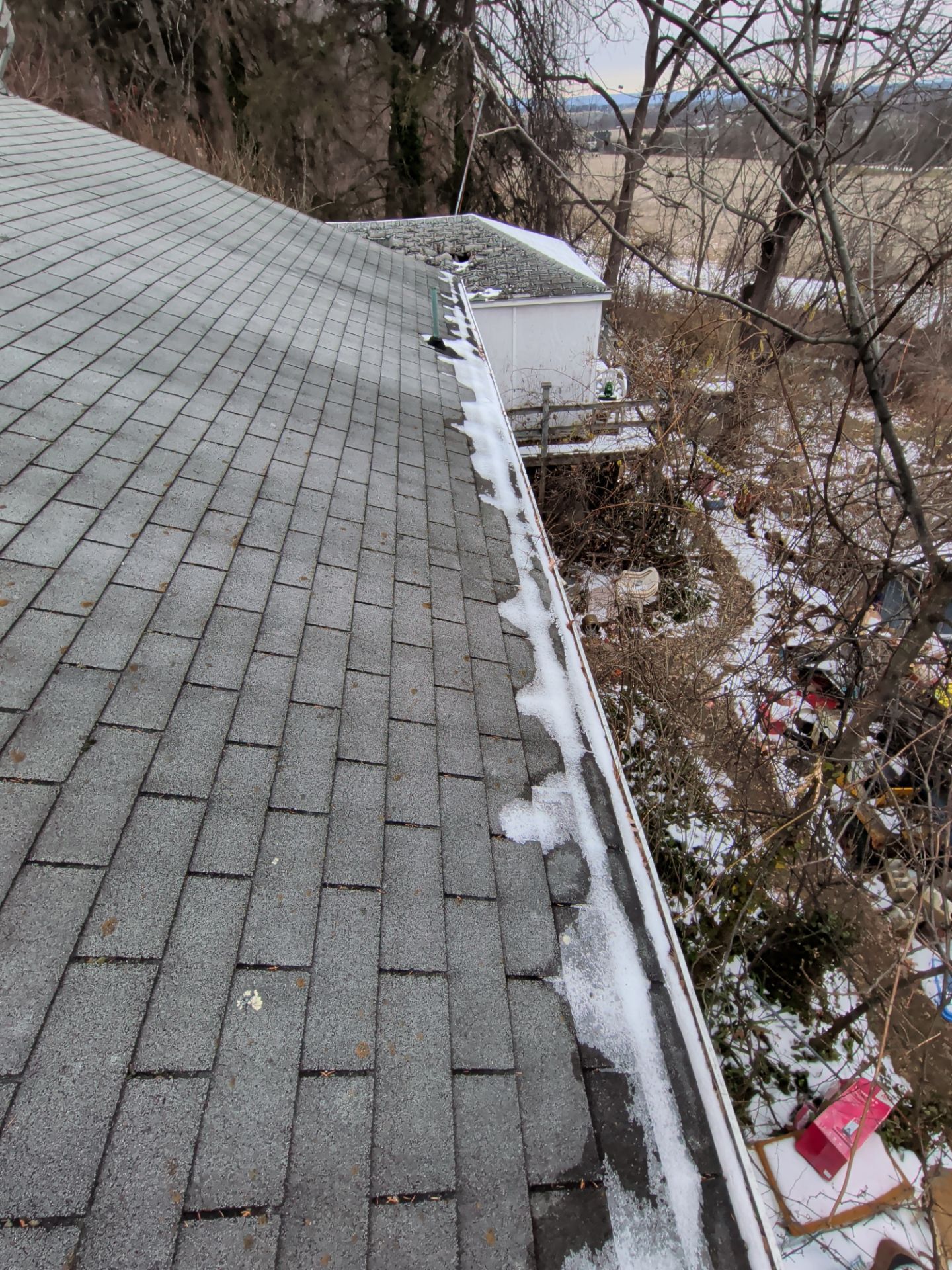 Asphalt shingle roof on Lynes Road in Dillsburg, PA inspected for a full roof replacement during winter conditions.
