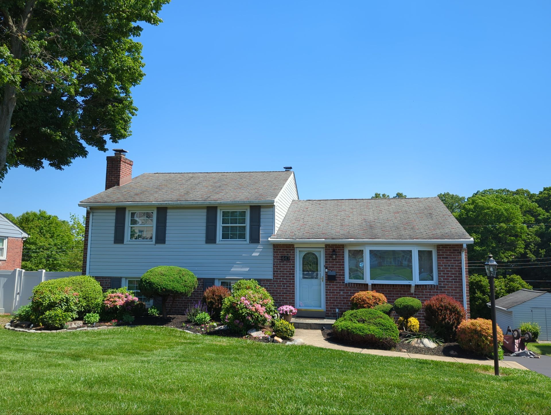 Completed asphalt shingle roof replacement on a residential home on Maddock Road in Springfield PA
