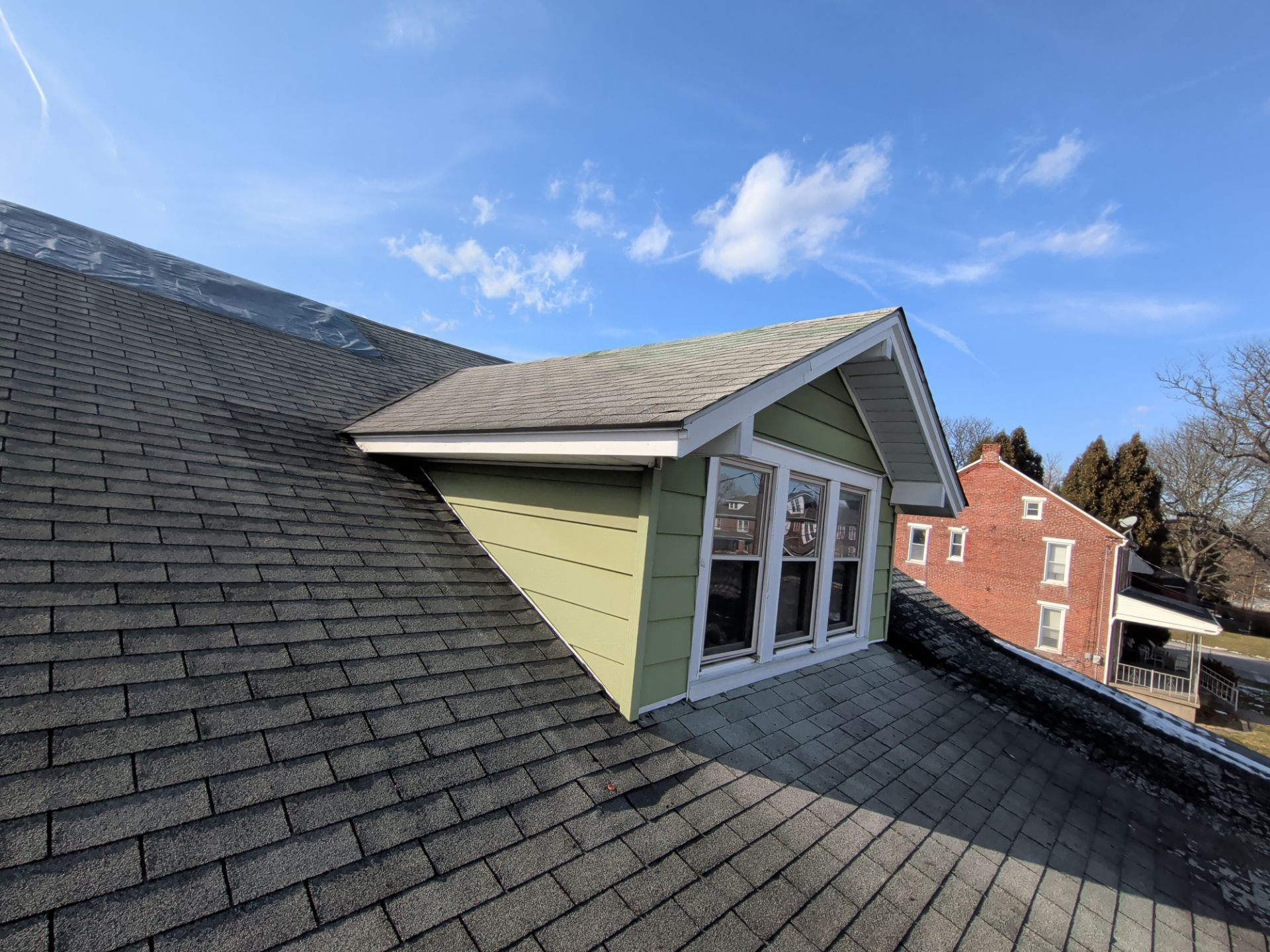 New asphalt shingle roof replacement around a dormer on a home in Wrightsville, PA.
