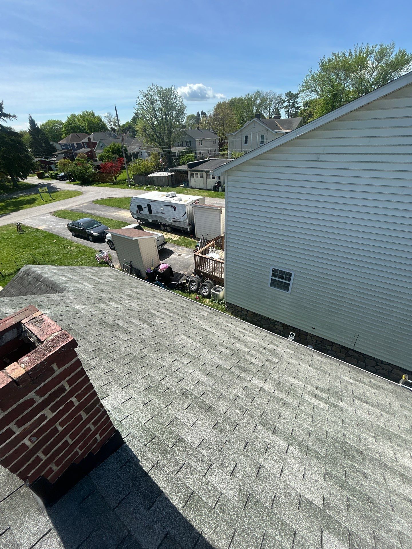 New asphalt shingle roof installed on a home along Pleasant Street in Hanover, PA with updated chimney flashing.
