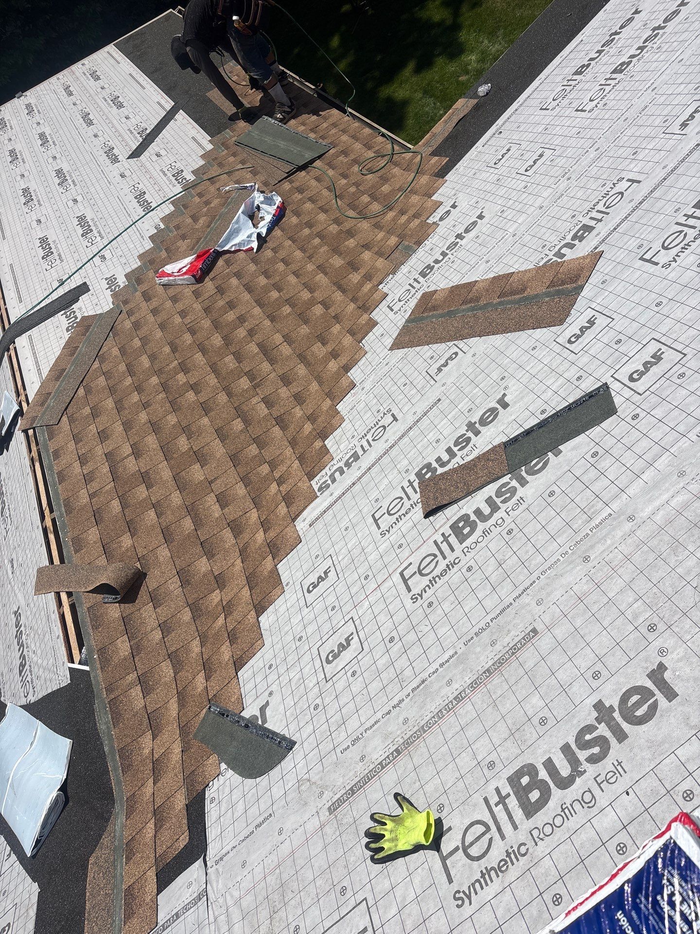 Roof replacement process on Irene Avenue in Ephrata, PA showing GAF synthetic underlayment and architectural shingles being installed on a residential home.