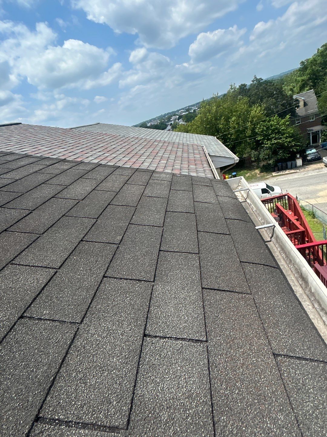 Asphalt shingle roof replacement in progress on East Oak Street in Montgomery County