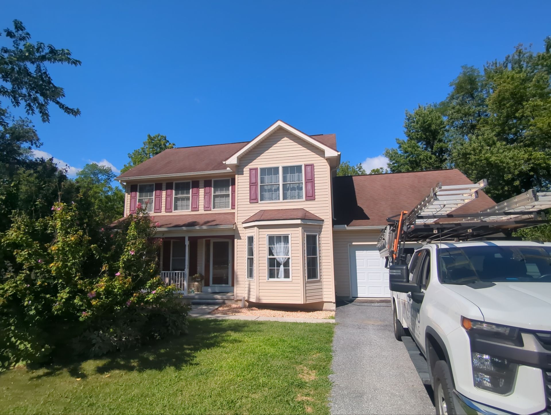 Residential home on Quail Drive in Dillsburg, PA prepared for a complete asphalt shingle roof replacement by Joyland Roofing.