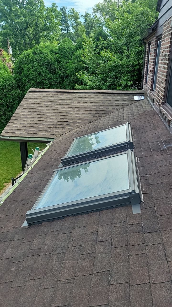 Asphalt shingle roof and skylight installation completed by Joyland Roofing on Andover Road