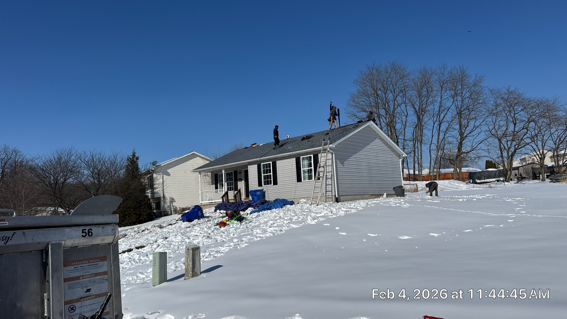 Roof replacement project underway on a residential home on Solar Drive in Dover, PA during winter conditions.
