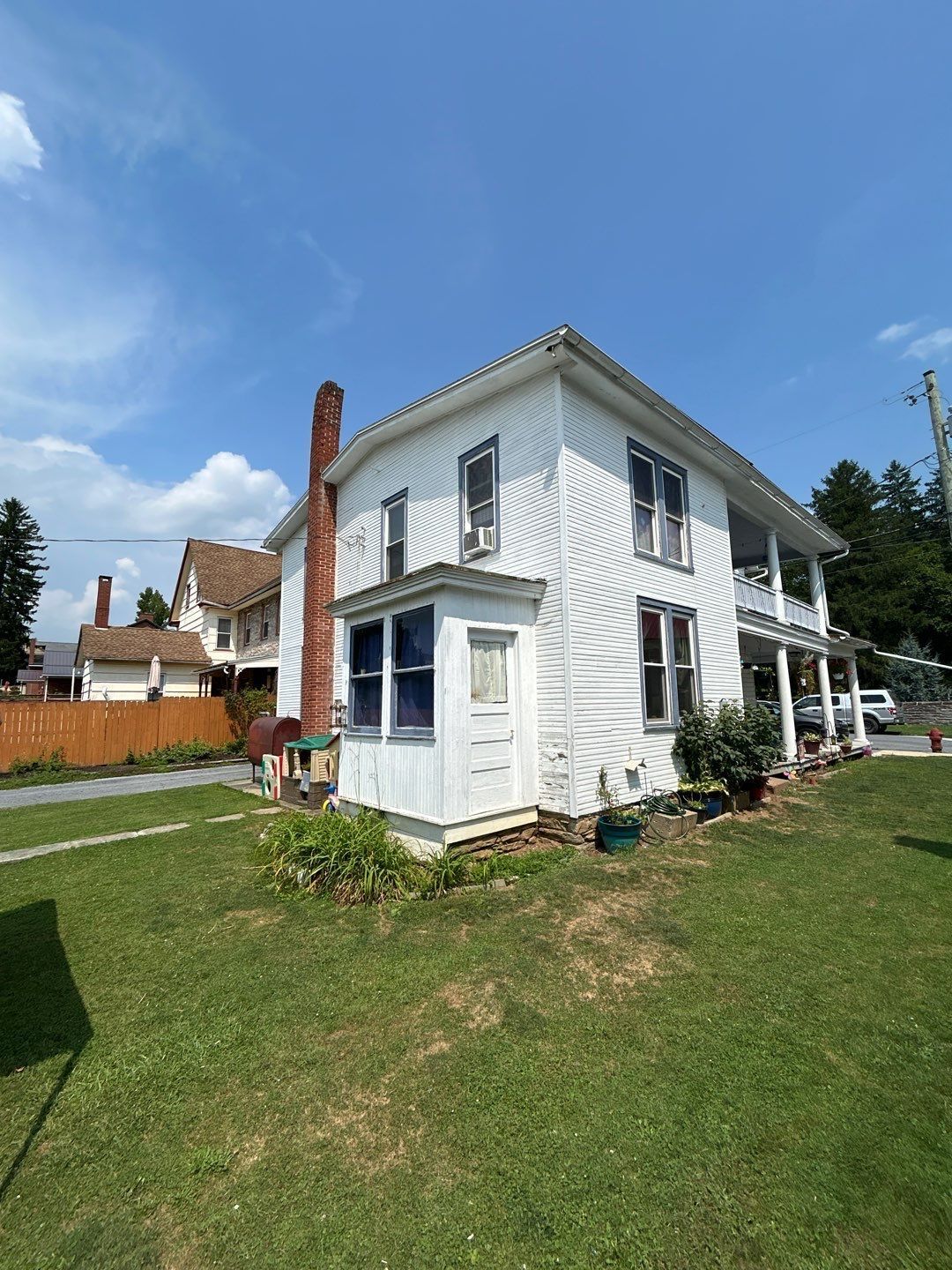 Older two-story home on South Market Street in Schaefferstown, PA scheduled for a professional asphalt shingle roof replacement by Joyland Roofing.