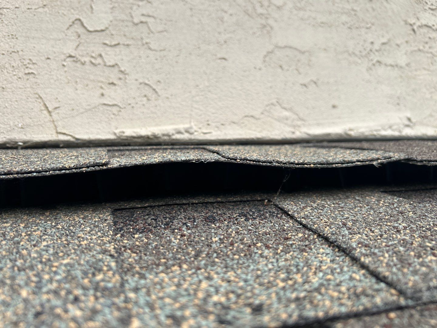 Close-up of a roofing system on Talon Drive in Ephrata, PA showing ridge ventilation and newly installed architectural shingles as part of a complete roof replacement project.