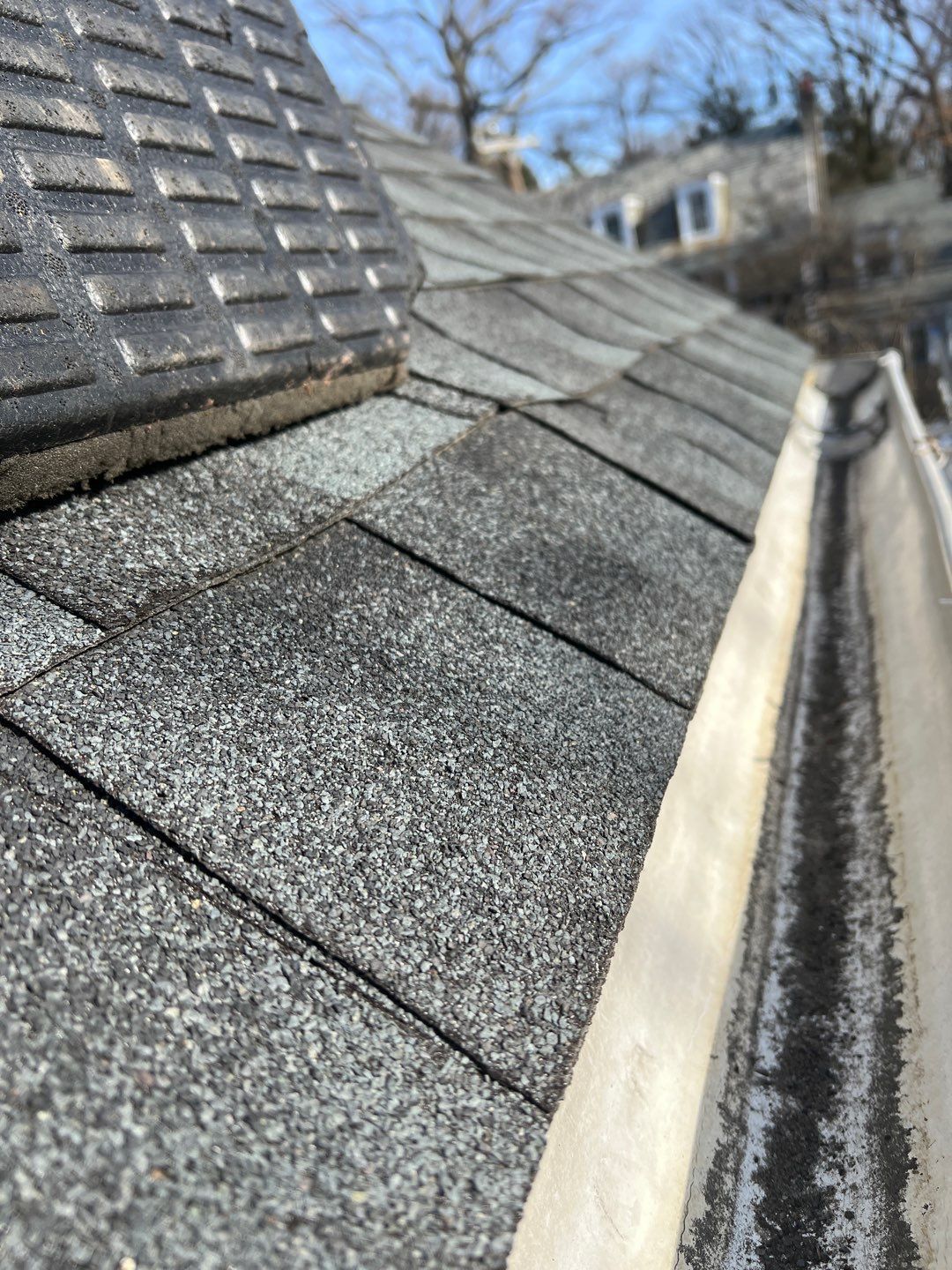 Roof shingle repair around chimney and roof edge in Wyndmoor, PA