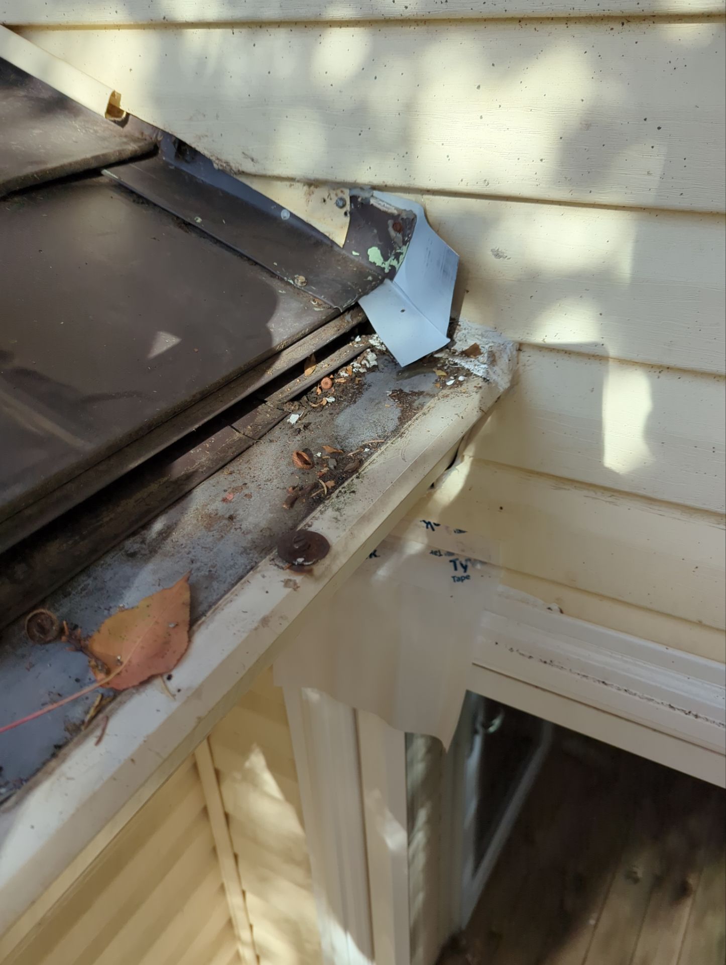 Close-up of damaged roof step flashing and roof-to-wall transition inspected on a home in Wineberry Drive, Shrewsbury, PA.