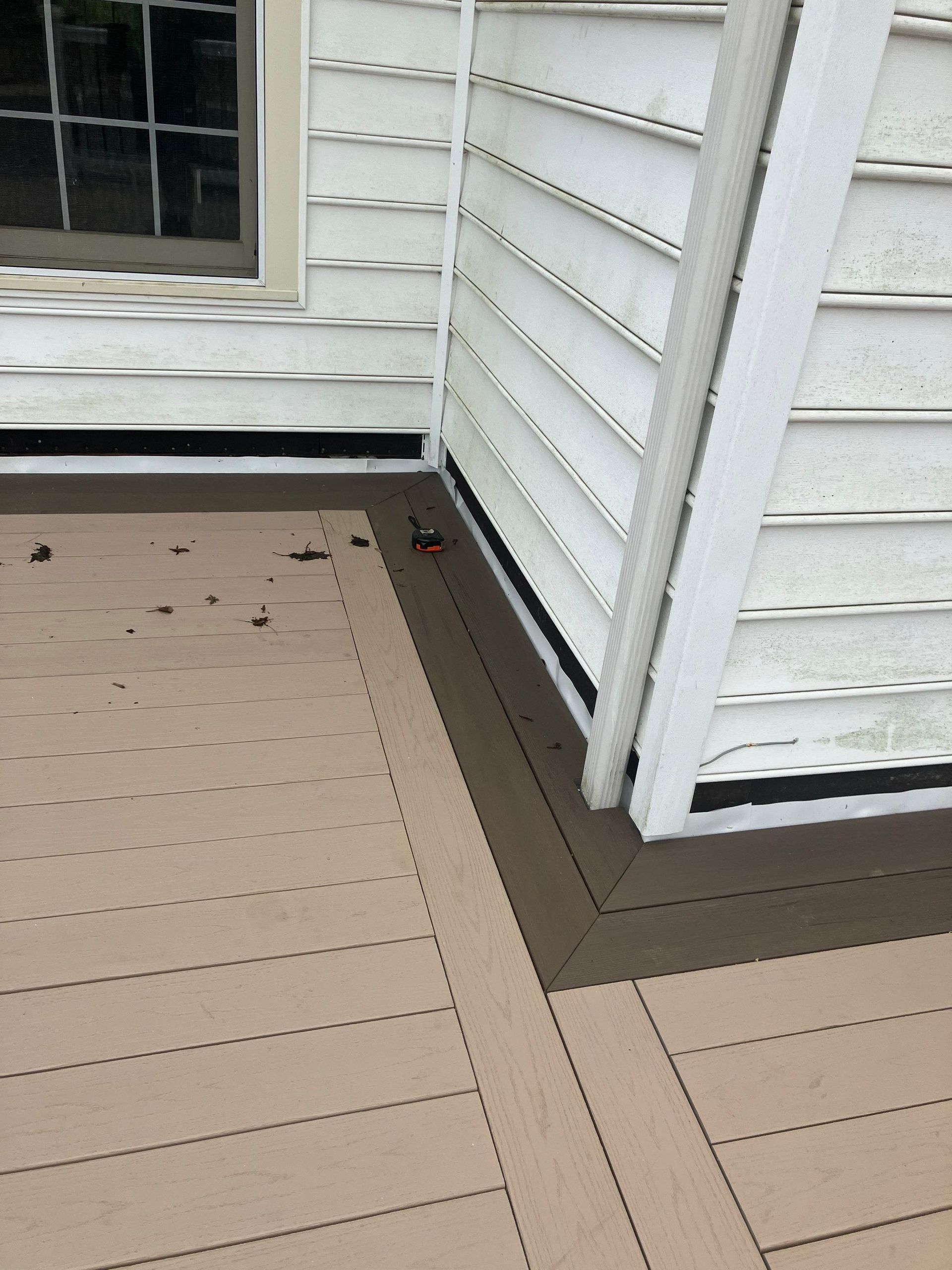 Roof-to-wall flashing detail along a deck and exterior siding on Cherry Circle in Glen Mills PA