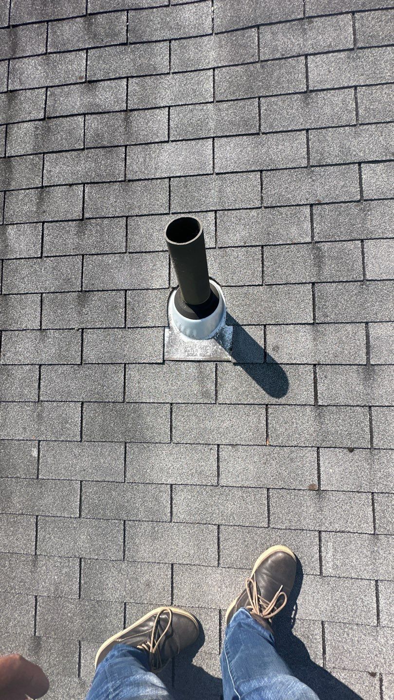 Roof vent pipe and asphalt shingles on a residential roof in Eagleville, PA