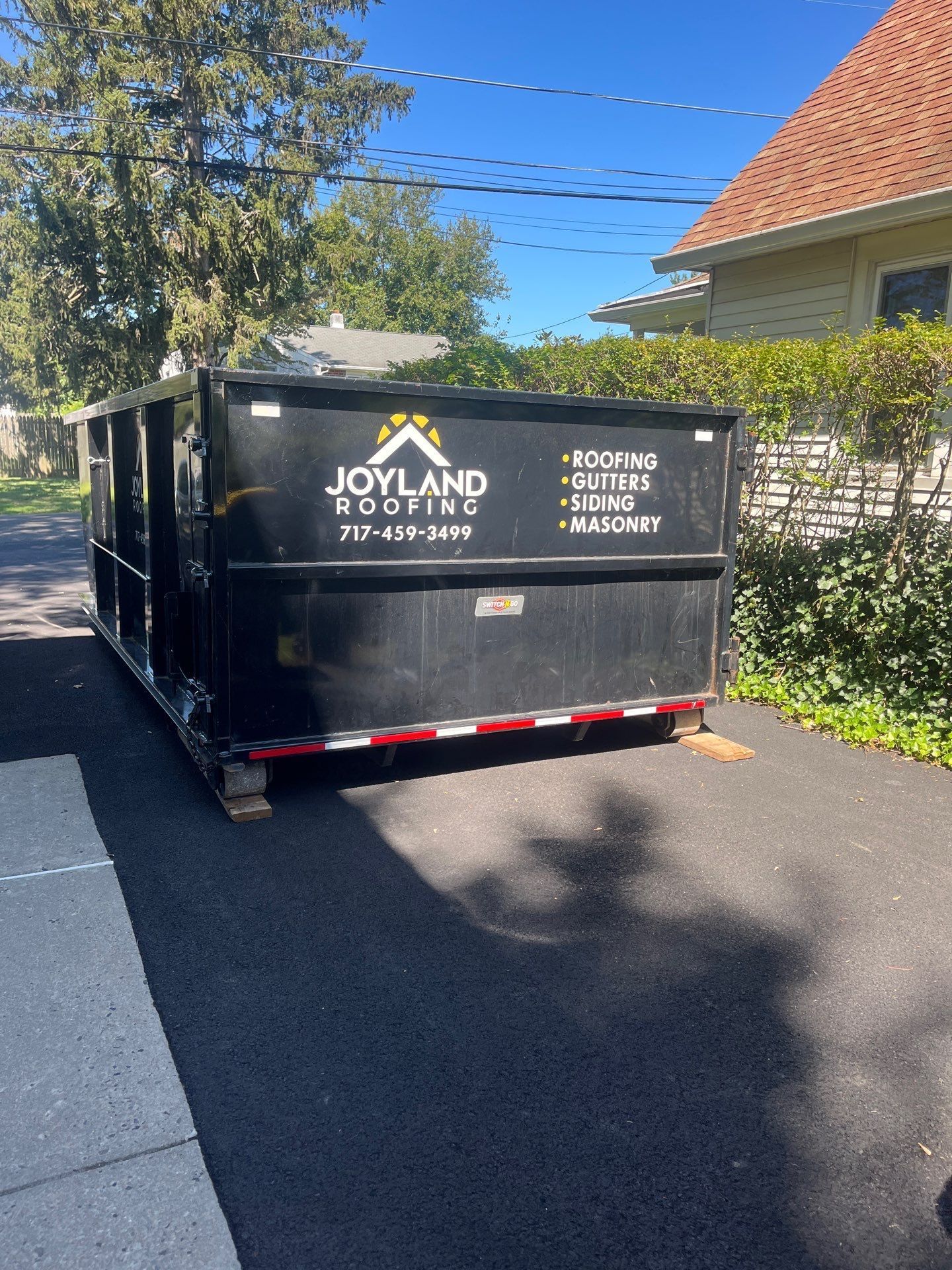Joyland Roofing project cleanup dumpster at a residential property in Horsham, PA