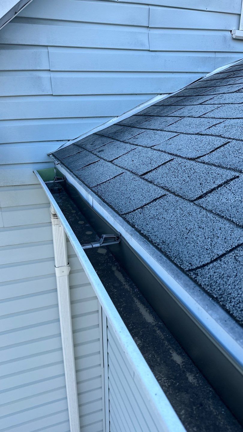 Residential roofing project on Fairview Avenue in Willow Grove, PA showing asphalt shingles, roof-to-wall flashing, and aluminum gutter system