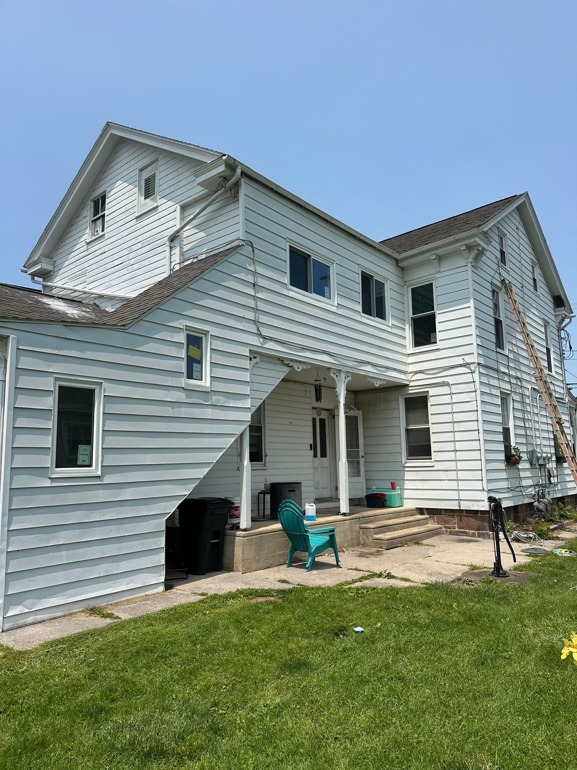 Residential roofing project on South Main Street in Dover, PA featuring a multi-story home with updated roofing improvements.