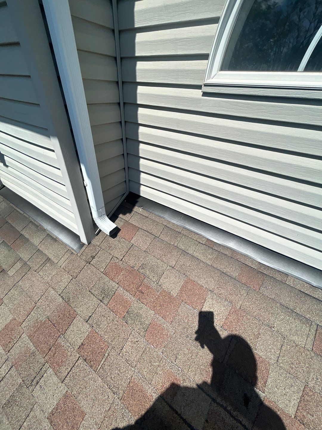 New asphalt shingle roof replacement with professionally installed wall flashing on Ruth Avenue by Joyland Roofing.