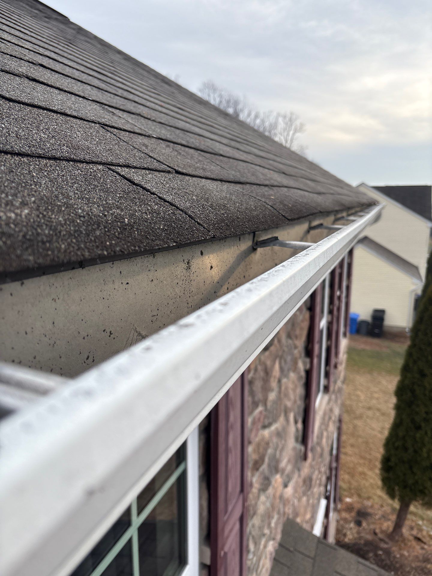 Asphalt shingle roof replacement and gutter system installation completed on a home along Sandpiper Lane in New Cumberland, PA.