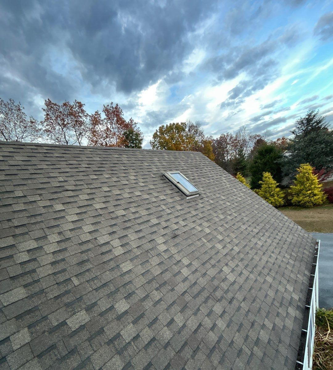 Asphalt shingle roof with skylight on a residential property along Scenic Drive in Hamburg, PA.