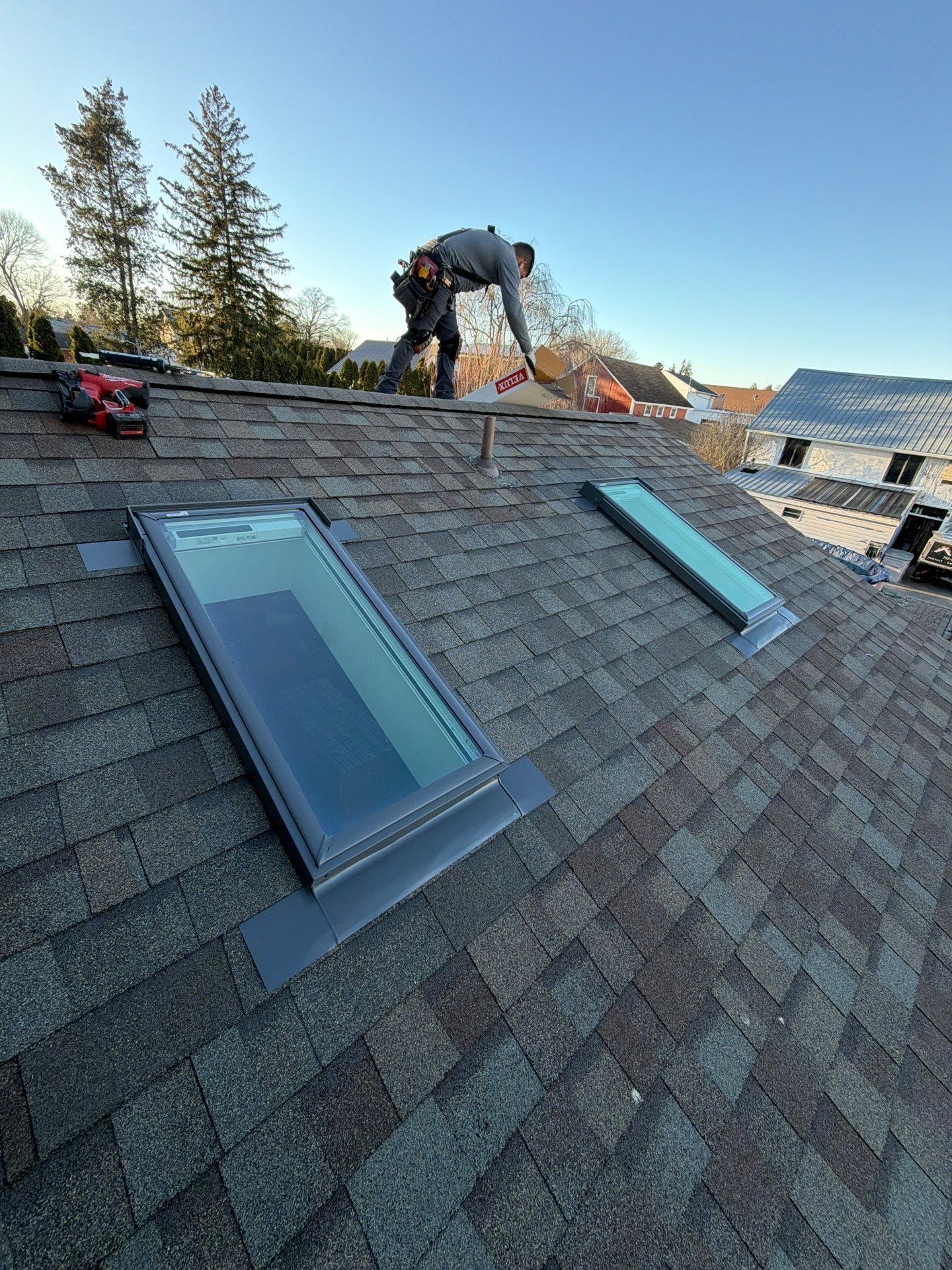 New skylight installation integrated into an asphalt shingle roof during a roof replacement project on New Street in East Petersburg, PA.