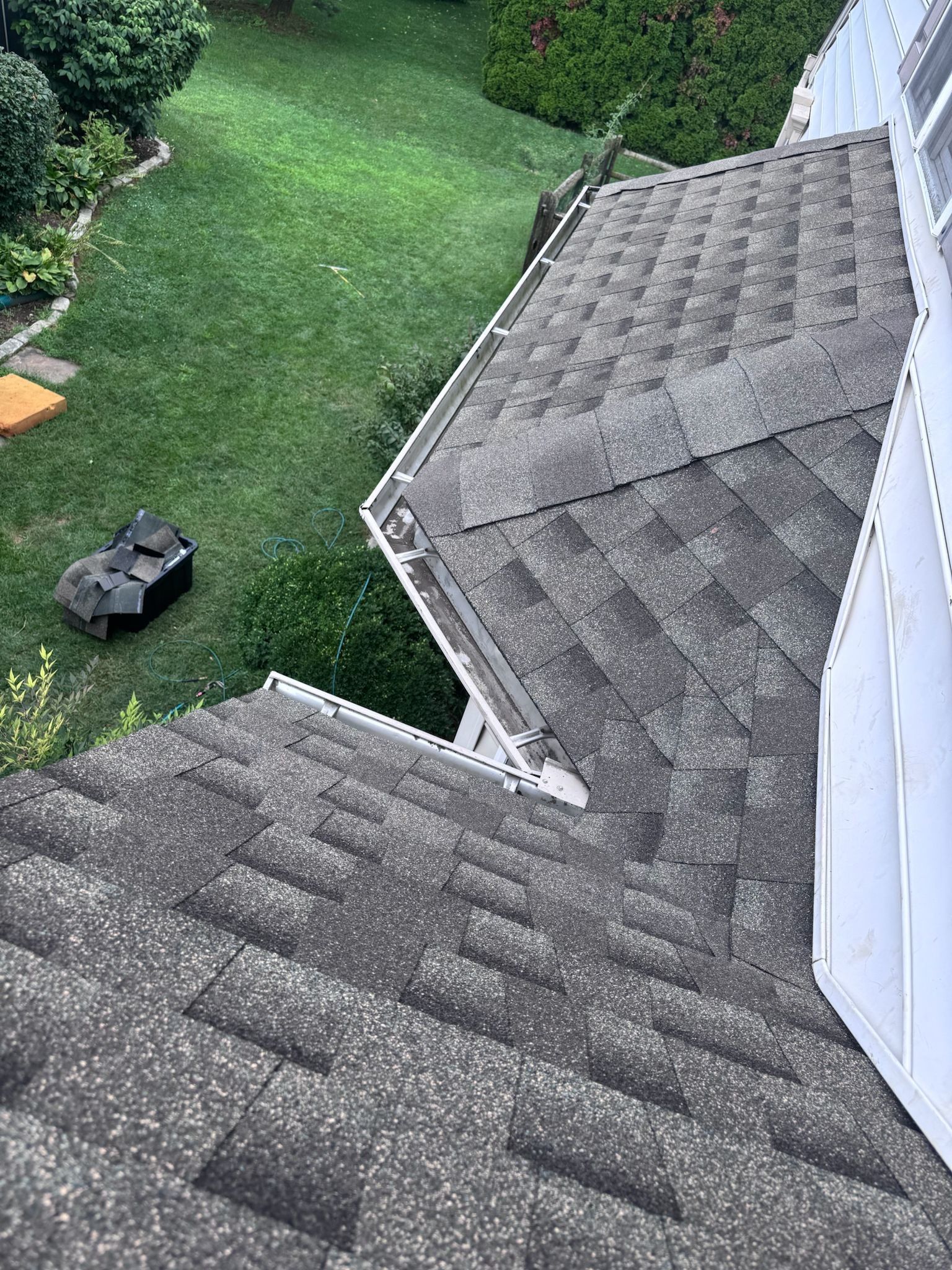 Asphalt shingle roof on South Brookefield Lane in New Holland, PA showing a roof valley and lower roof section inspected before a roof replacement.