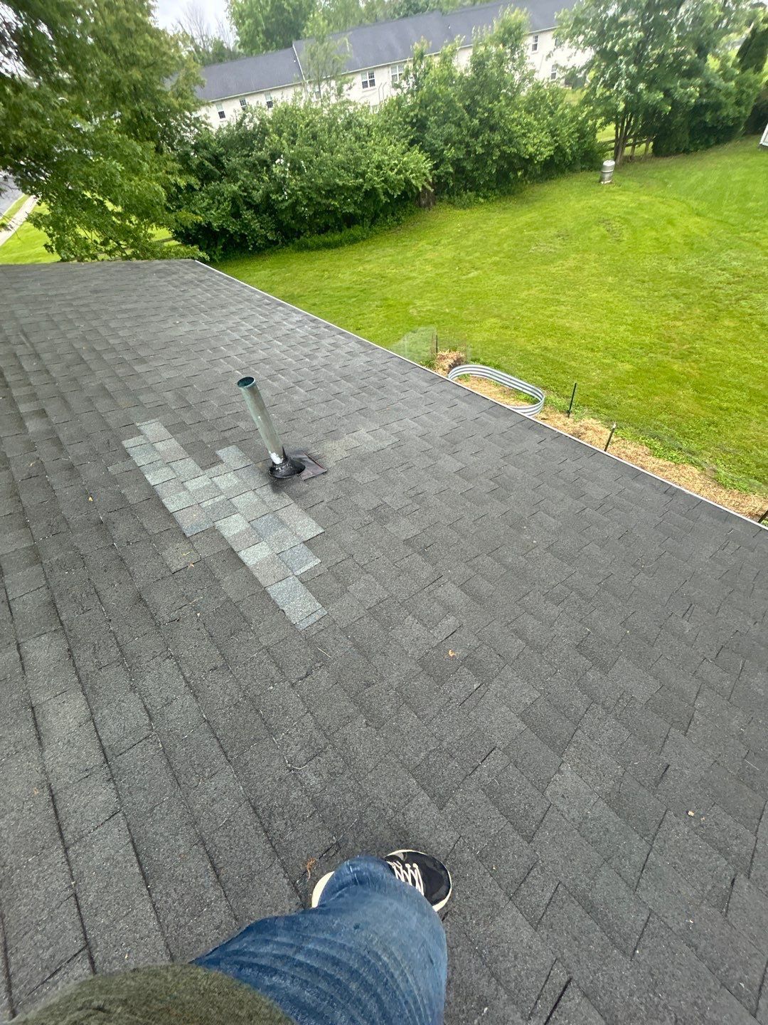Asphalt shingle roof and vent pipe inspected during roofing work on South Elm Street in Kutztown, PA.