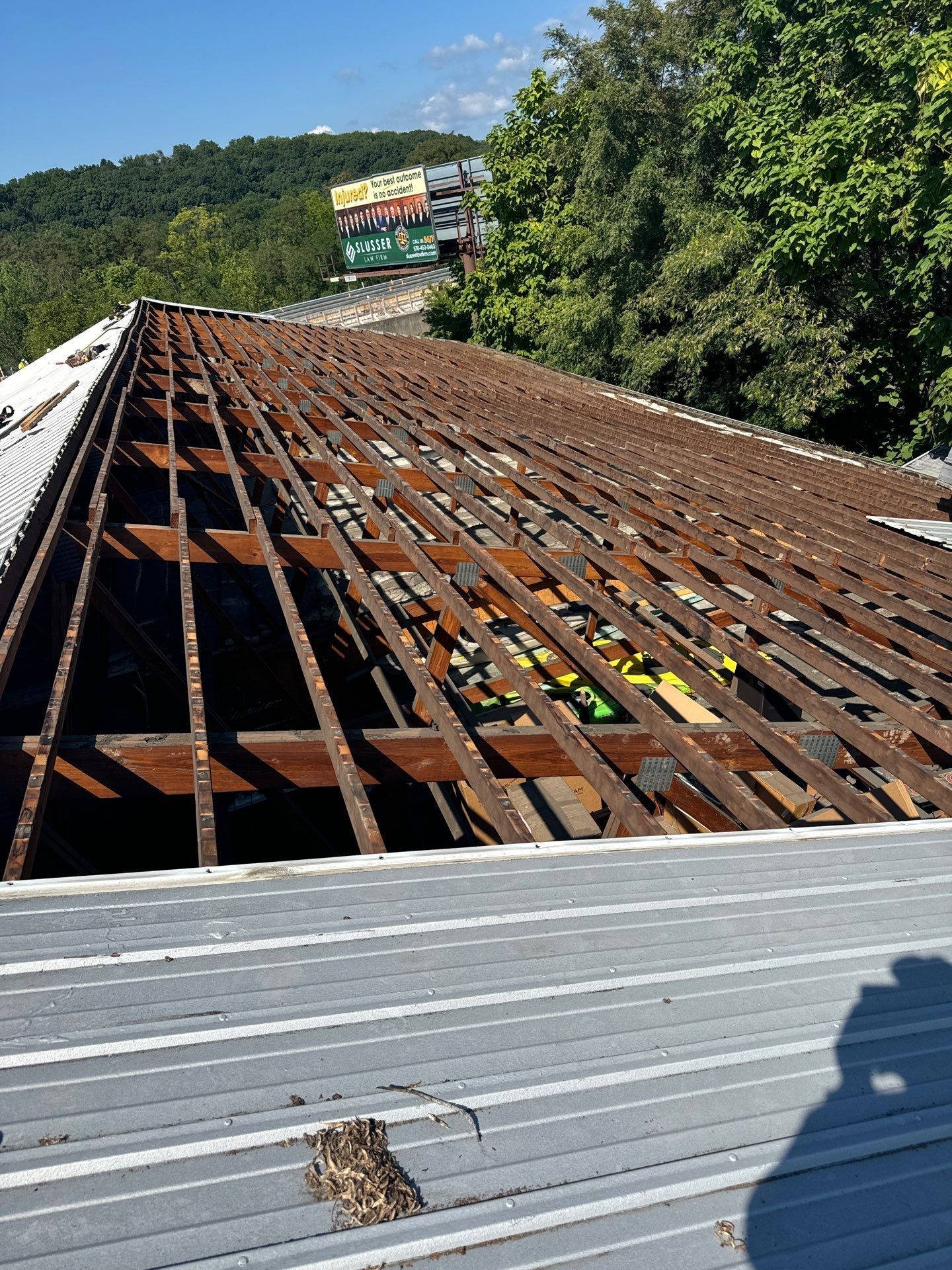 Roof replacement in progress with exposed wood framing on South Fourth Street in Hamburg, PA.