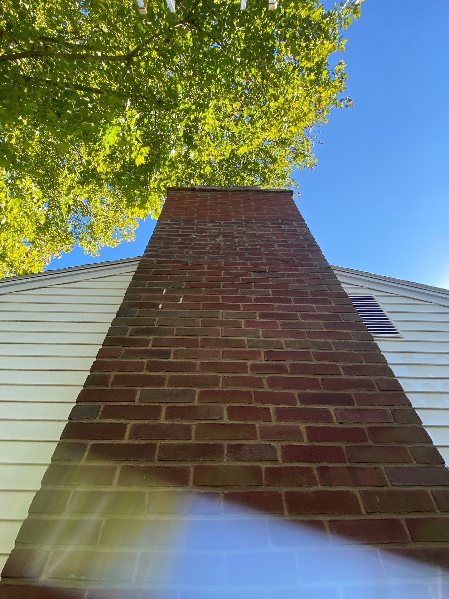Brick chimney inspected for masonry condition on South Stoner Avenue in Shiremanstown, PA.