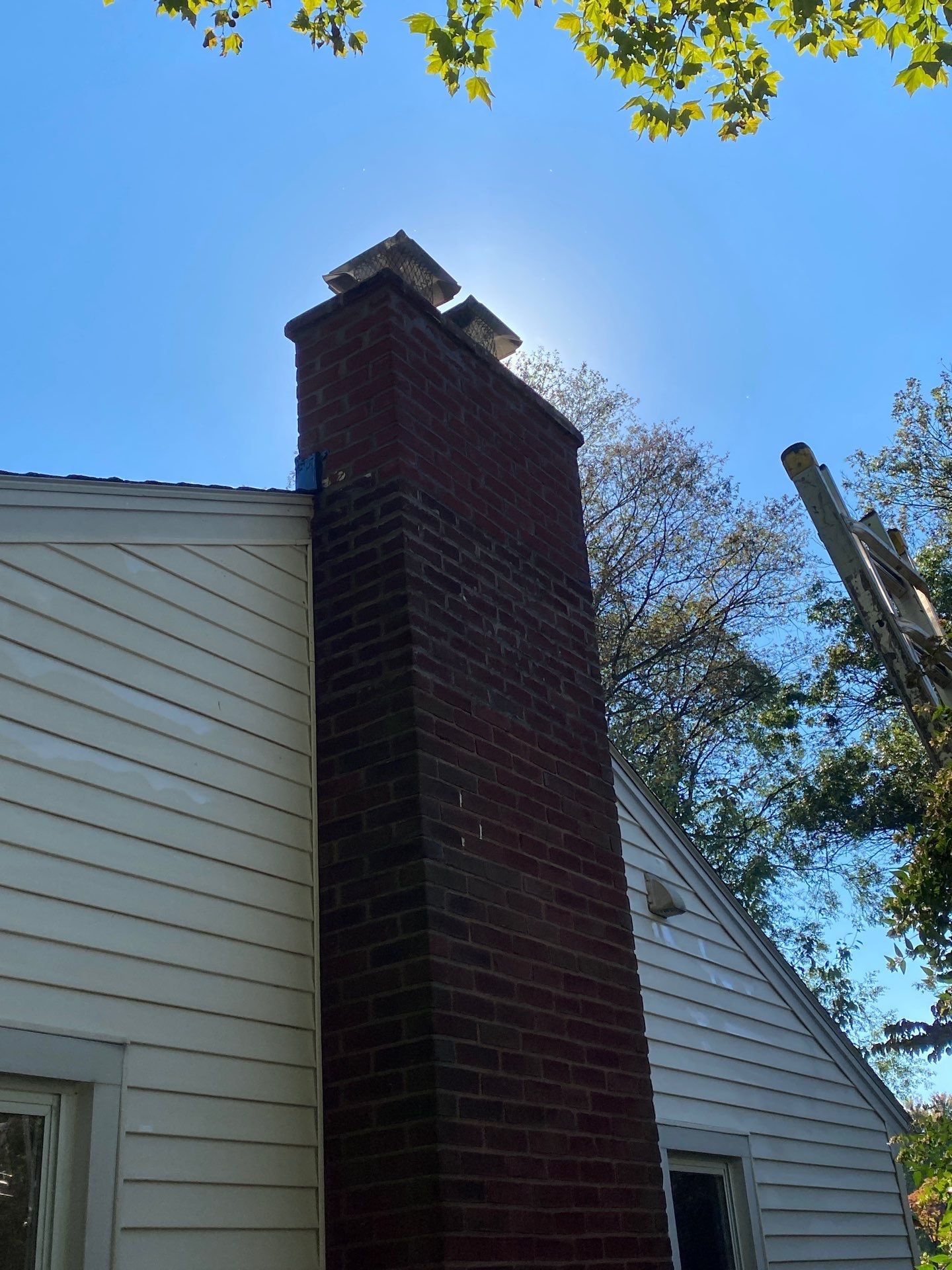 Chimney flashing and roof repair completed on a home along South Stoner Avenue in Shiremanstown, PA by Joyland Roofing.