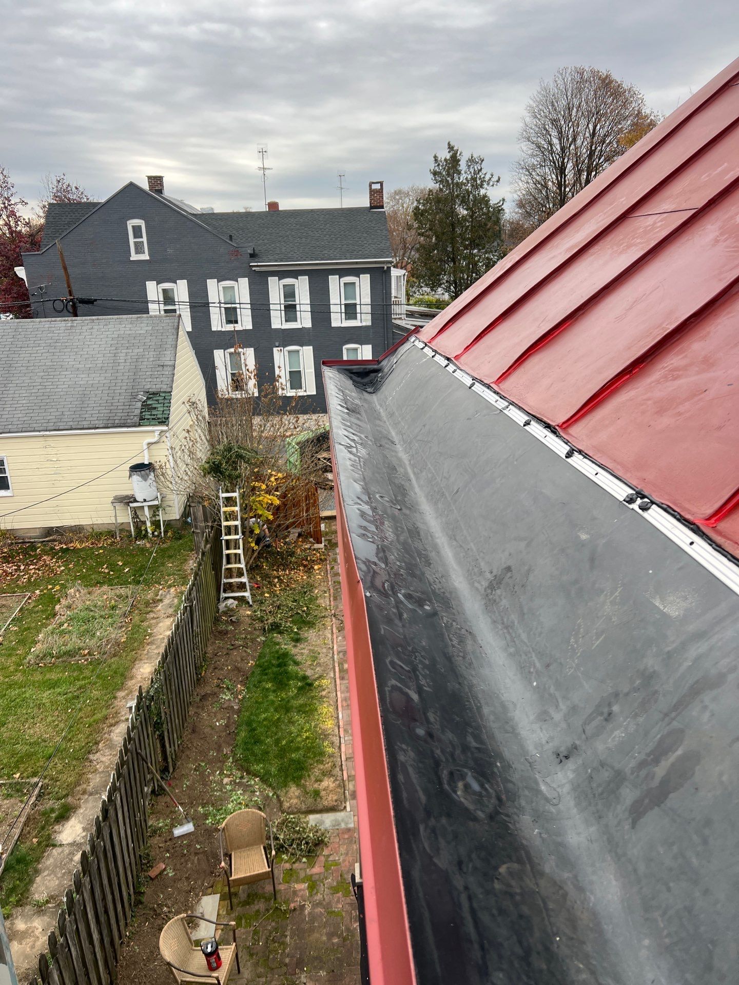 Standing seam metal roof connected to a flat roofing system on South Pitt Street in Carlisle, PA.