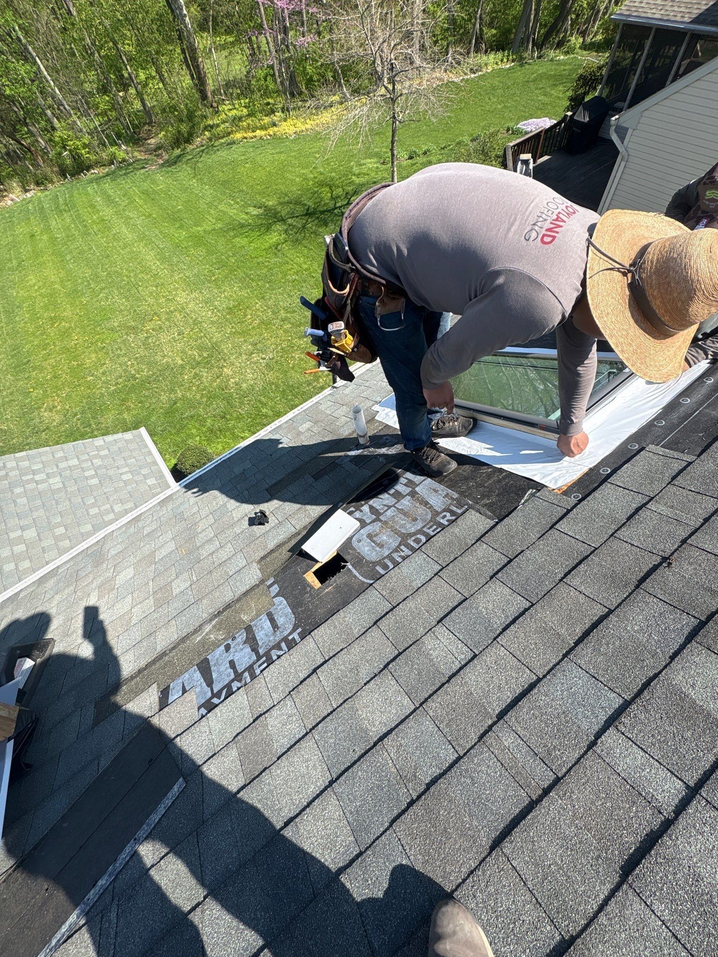 Roof repair around a skylight on West Charlotte Street in Millersville, PA with new flashing and waterproof underlayment installation.