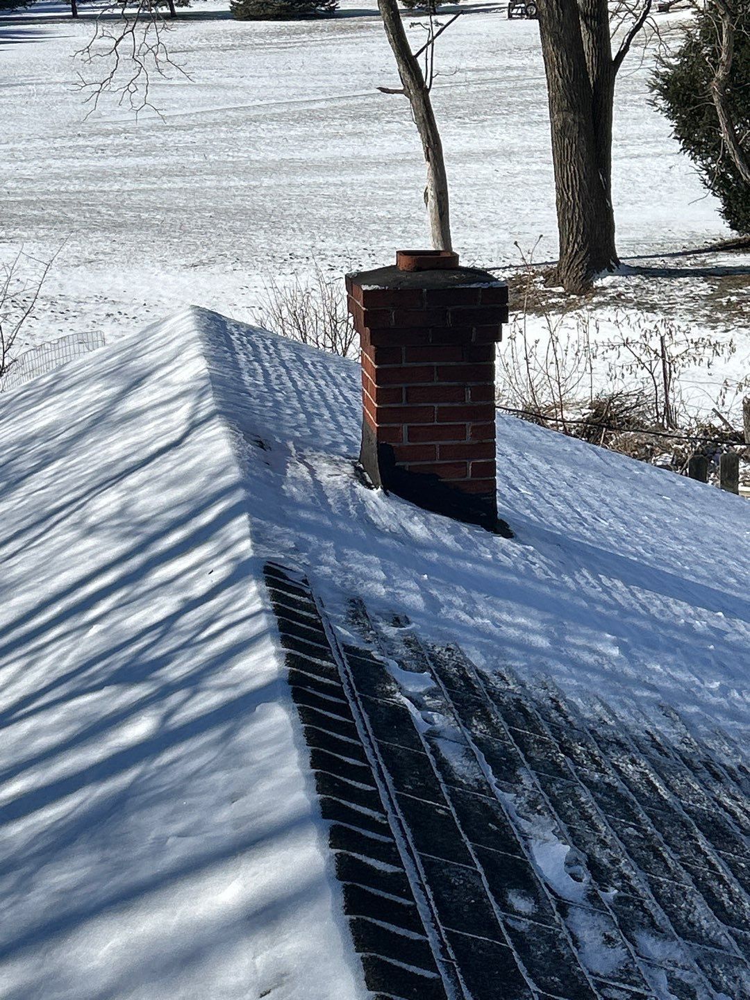 Residential roof and chimney on West Philadelphia Avenue in Boyertown, PA.