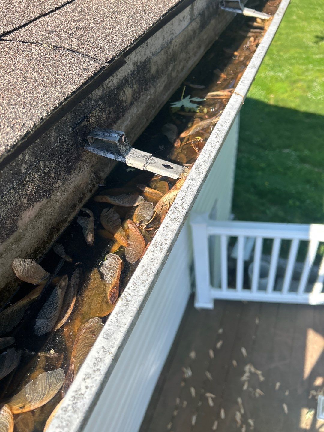 Clogged gutter filled with leaves and debris during a roof replacement project on Williams Road, Myerstown, PA.