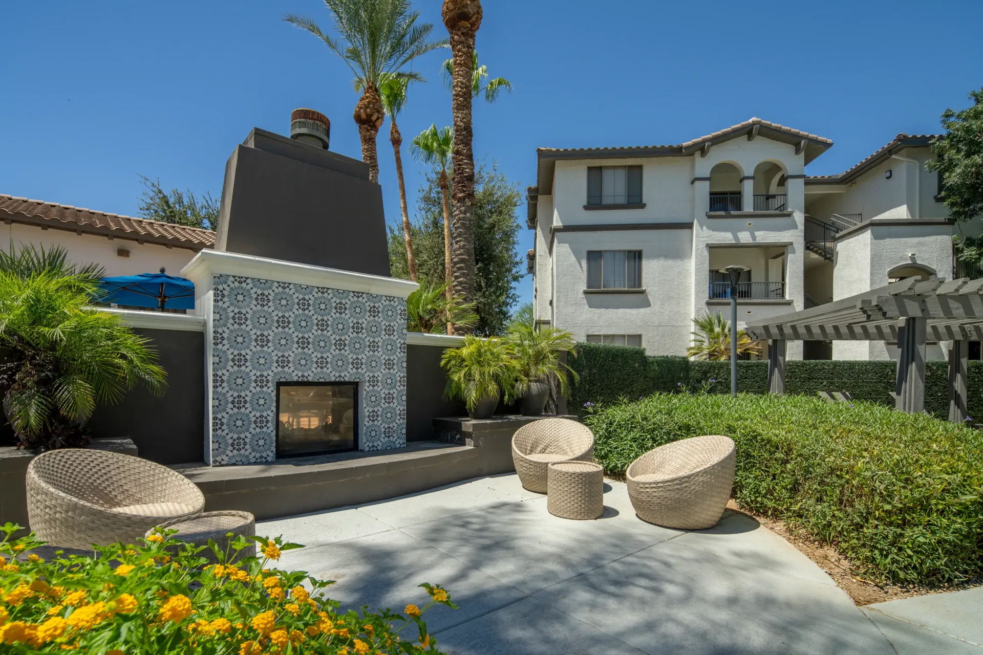 Outdoor fireplace and seating area at apartment complex
