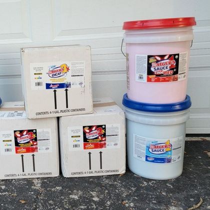 A stack of boxes and buckets of solvent-free chemicals A stack of boxes and buckets of solvent-free chemicals