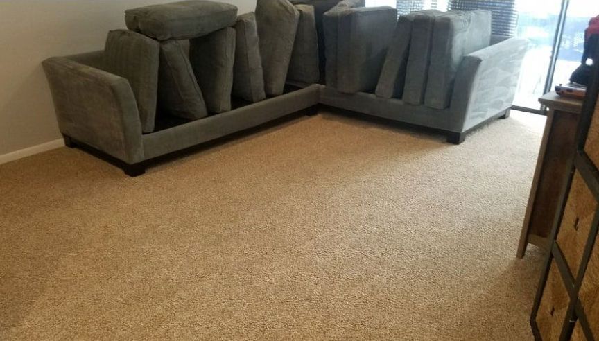 After photo of a couch in a living room.