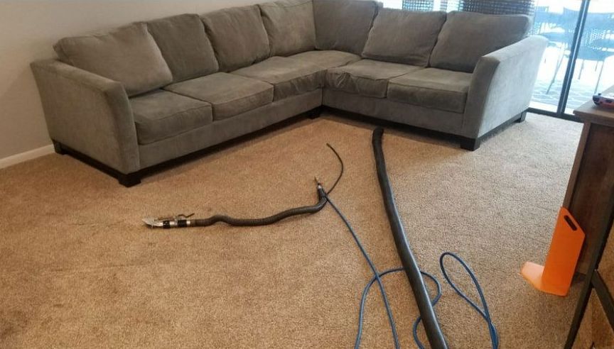 Before photo of a couch in a living room.