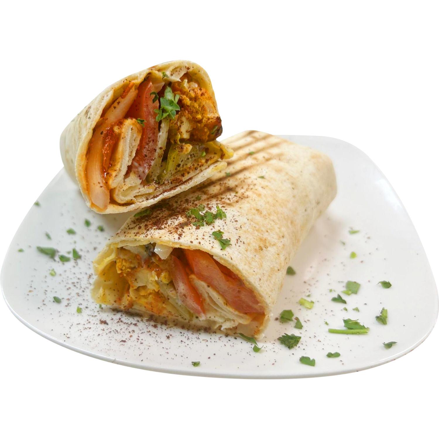 A tortilla wrap with chicken , tomatoes , and lettuce on a white plate.