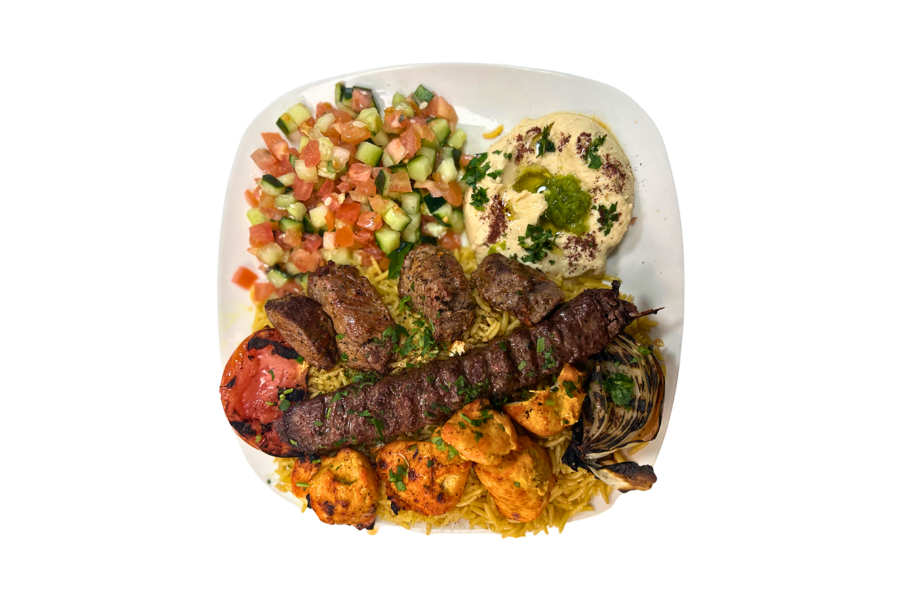 A plate of food with meat , rice , and vegetables on a white background.