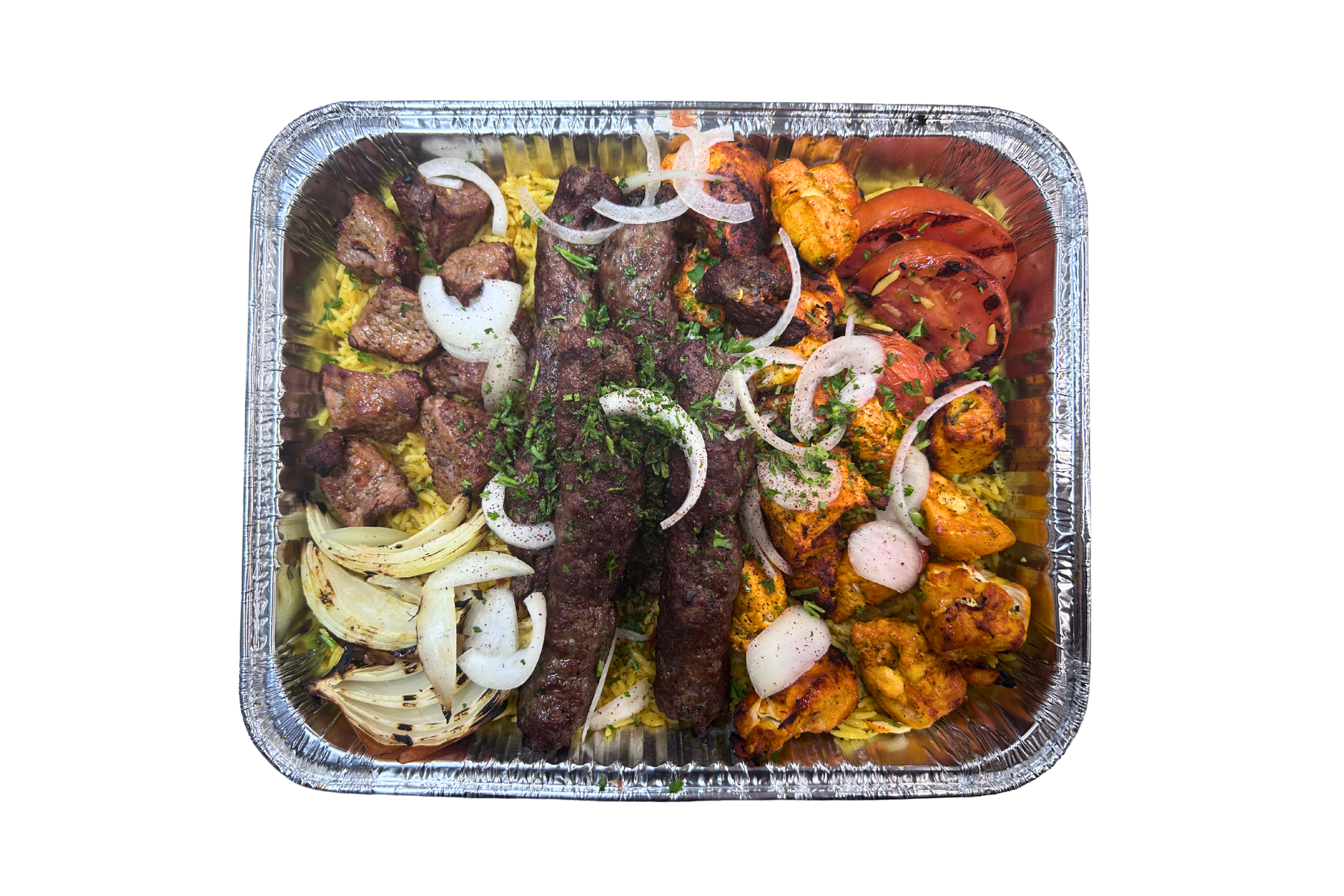 Aluminum foil tray filled with a variety of food on a white background.