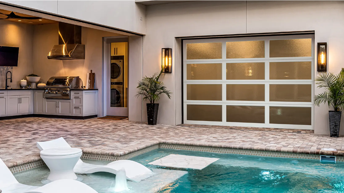 All glass garage door for pool area with white aluminum frame and obscure glass design in Bradenton, FL