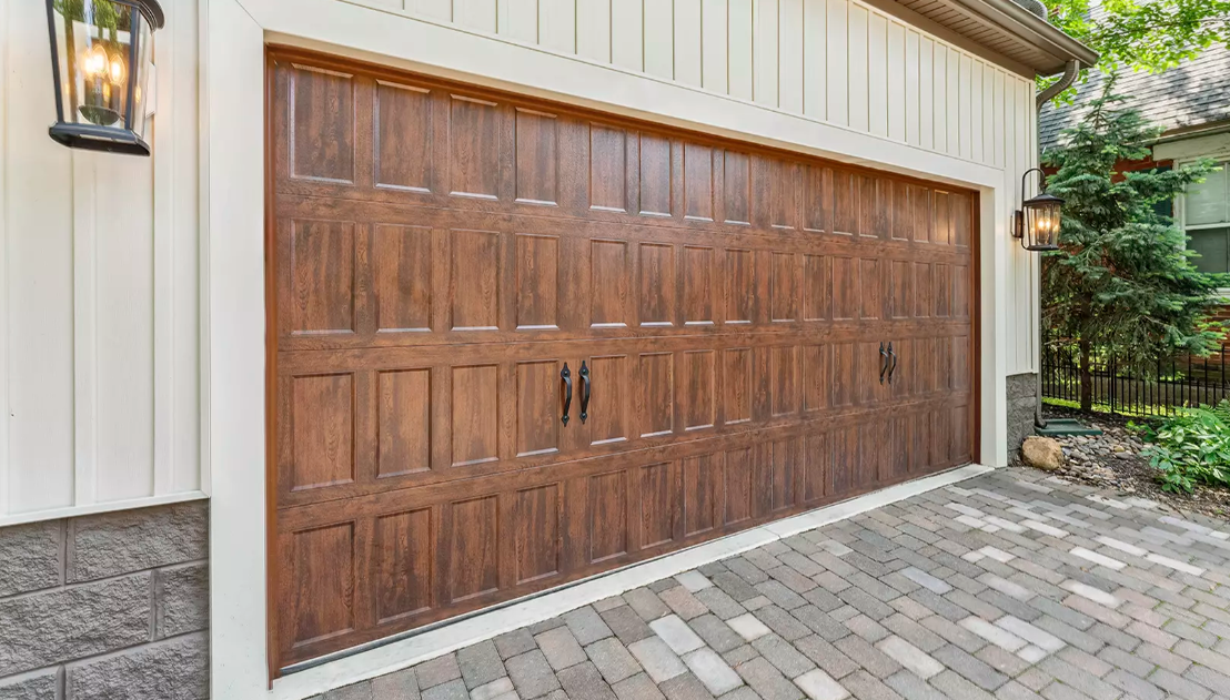 Steel garage door with narrow squares with wood color finish and texture with black decorative hardware in Sarasota, FL