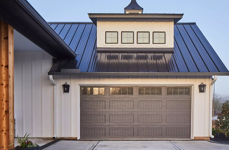 Steel double car garage door in Florida bronze color with window top section and heat enameled paint in Bradenton, FL