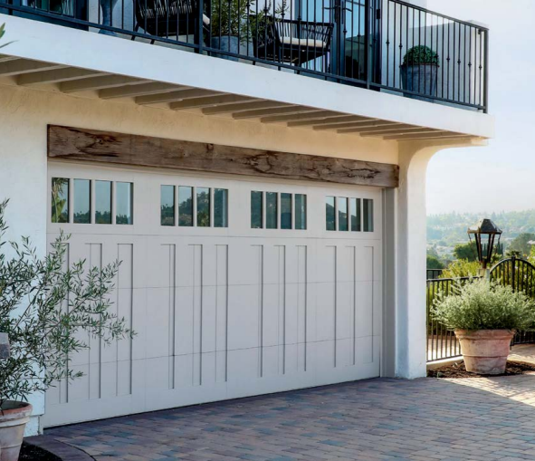 Beautiful wood-style garage door with protective cladding overlay in Sarasota, FL