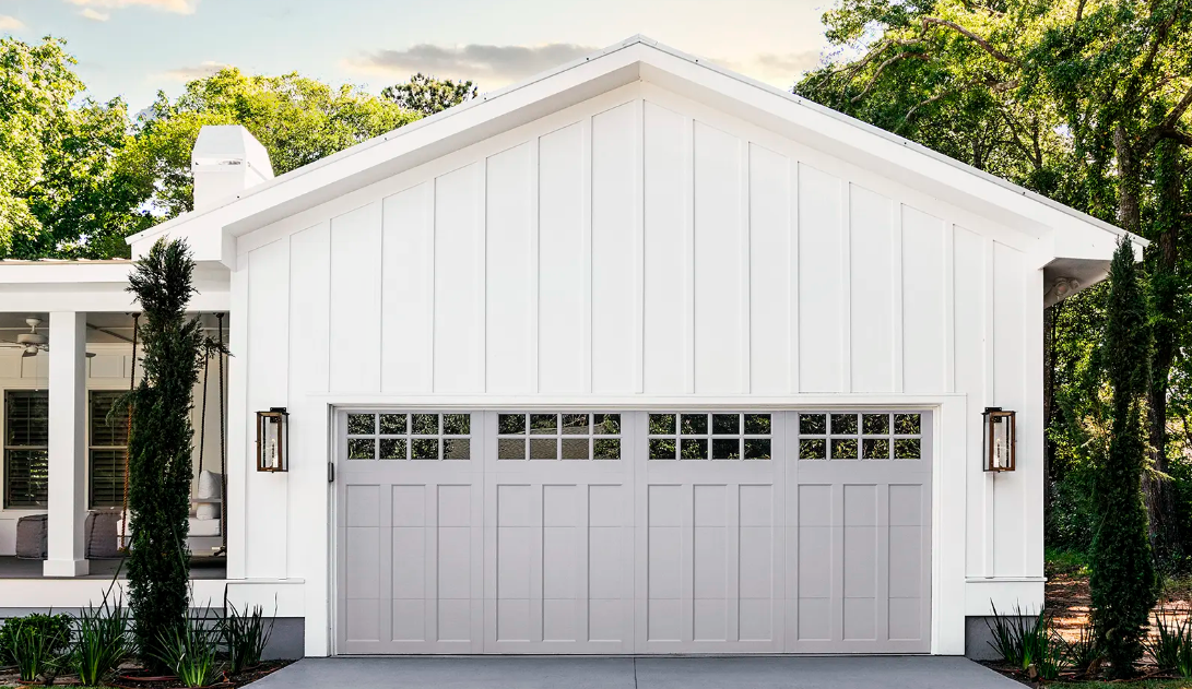 Barn style garage door with rustic look and window top section in Bradenton, FL