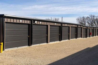 Exterior view of drive-up self storage units at The Reserve Self Storage in Gunter, TX with ground-level access