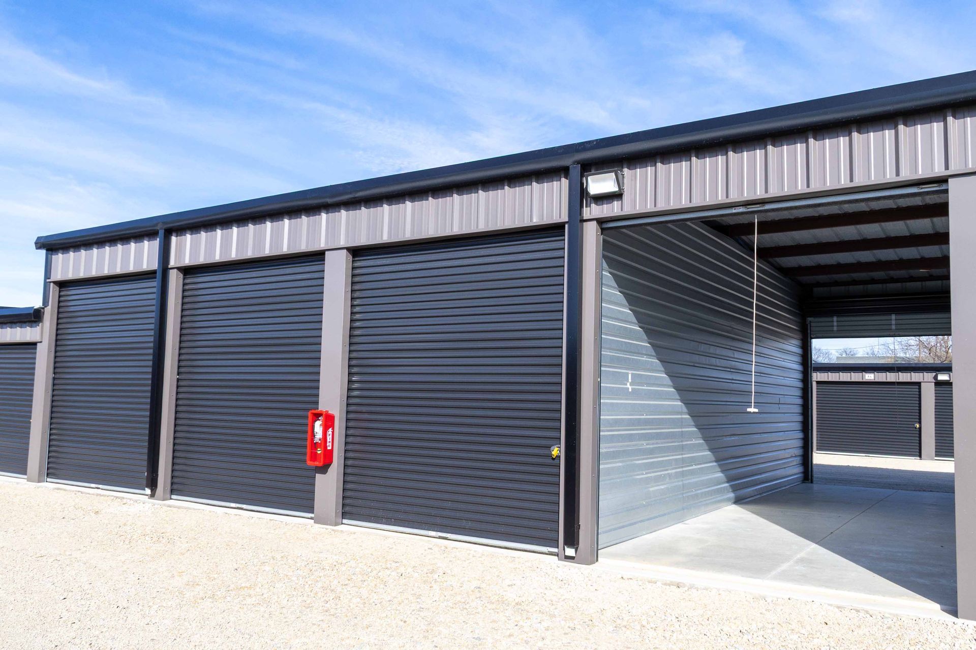 Drive-up self storage unit with open door at The Reserve Self Storage in Gunter, TX showing easy ground-level access