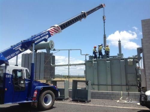 A Crane is Being Used to Lift a Large Transformer — CA Crane Hire in Noosa, QLD