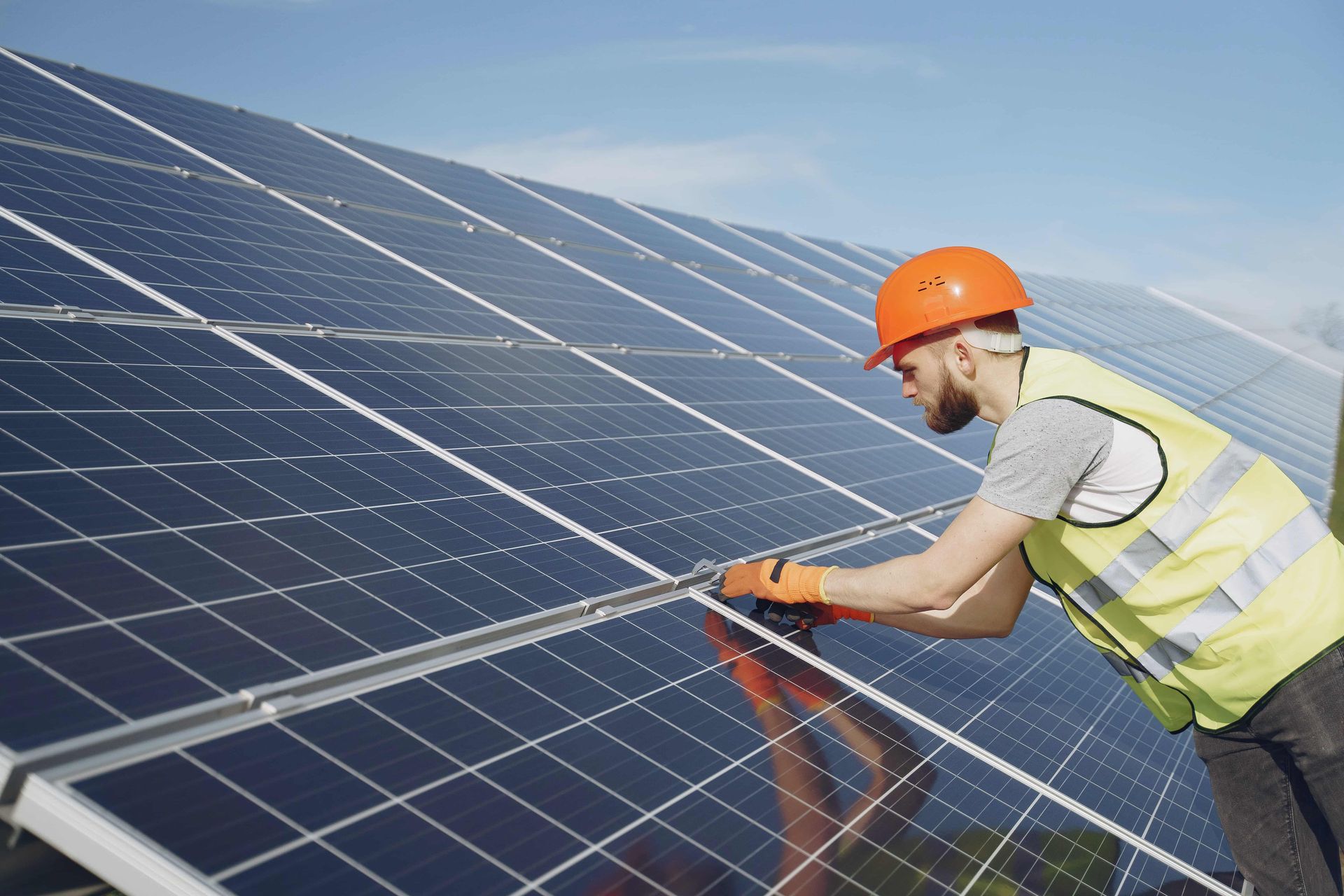 Solar Technician Installing Solar Panel