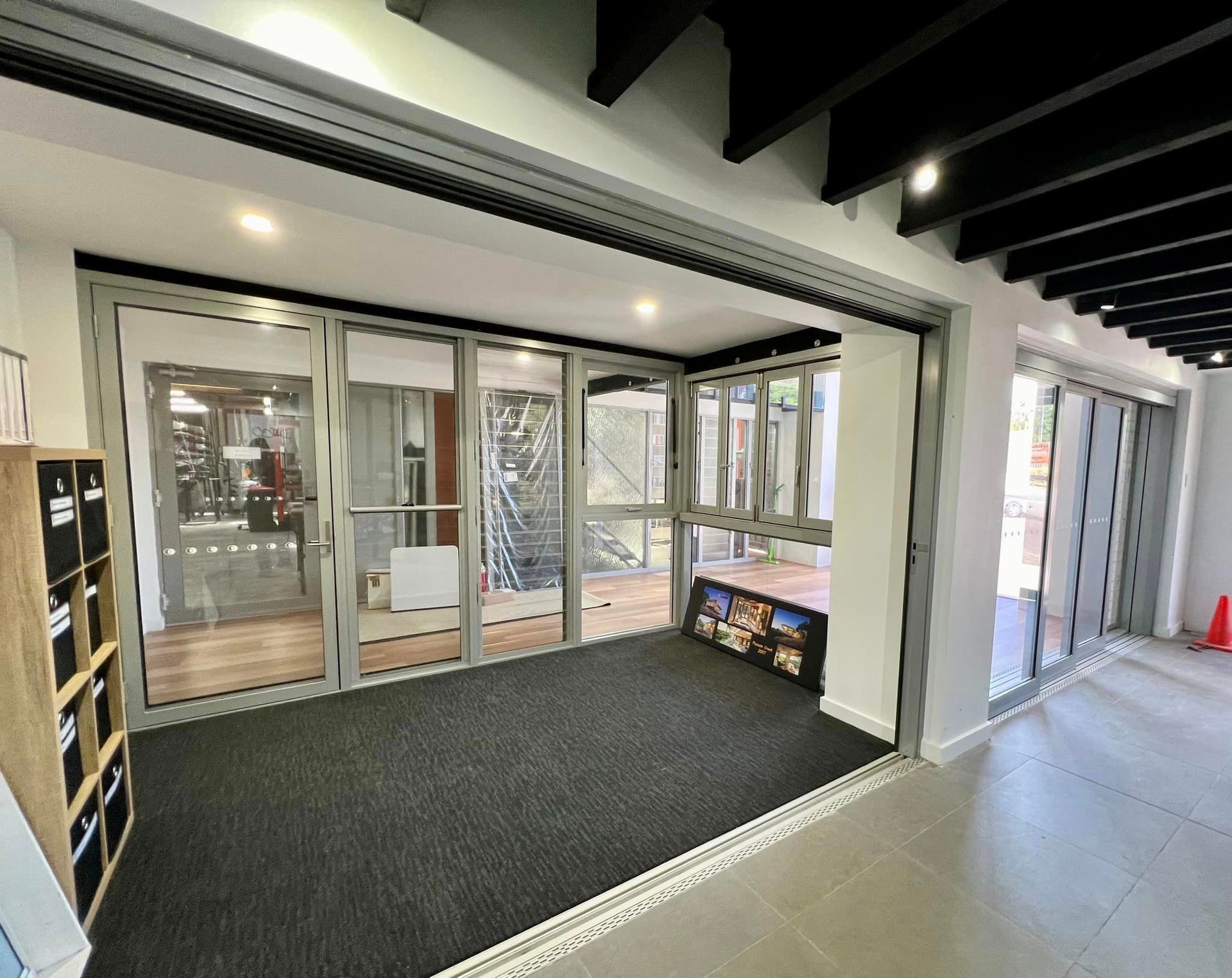 A Large Sliding Glass Door Is lEading To An Outdoor Area — Datco Windows & Doors Pty Ltd In Byron Bay, NSW