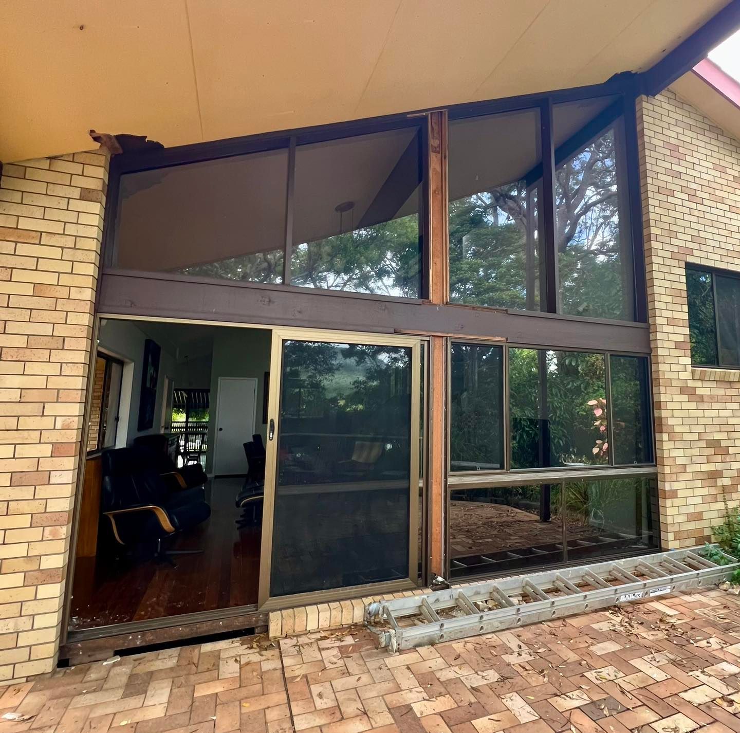 Exterior of a House With Large Windows and Sliding Glass Door — Datco Windows & Doors Pty Ltd In Coomera, QLD